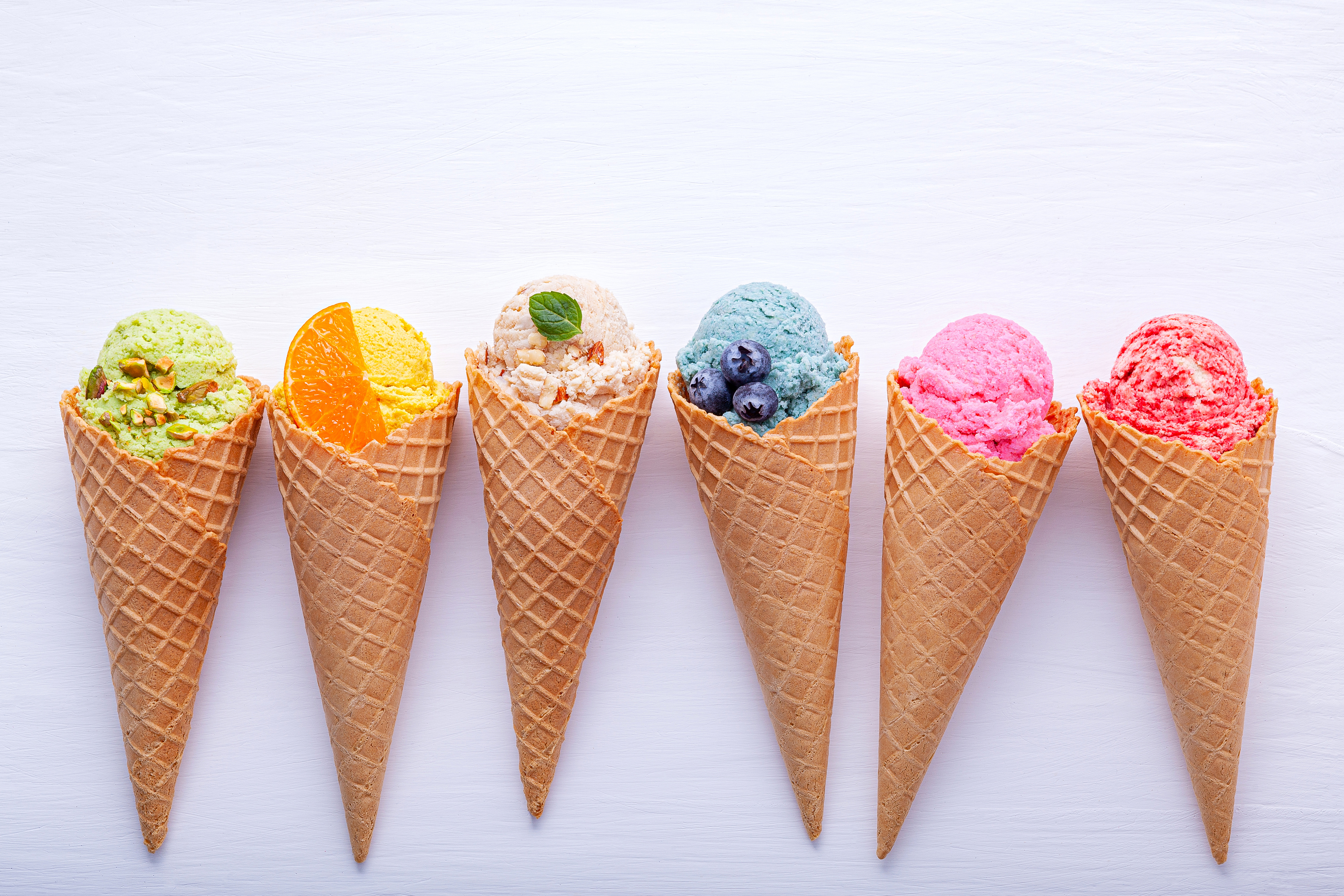 Various Flavors of Ice Cream in Wafer Cones Flatlay